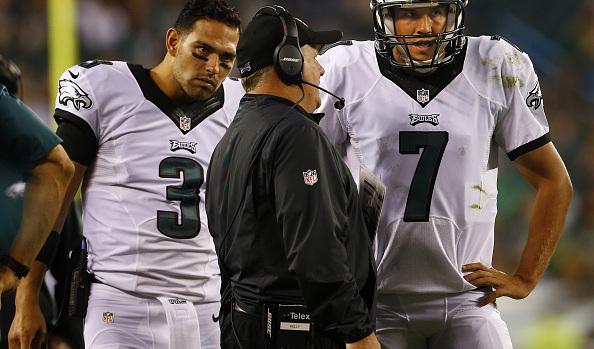 PHILADELPHIA, PA - SEPTEMBER 20: Head coach Chip Kelly of the Philadelphia Eagles talks with quarterbacks Mark Sanchez #3 and Sam Bradford #7 during a timeout against the Dallas Cowboys during the fourth quarter of a football game at Lincoln Financial Field on September 20, 2015 in Philadelphia, Pennsylvania. The Cowboys defatted the Eagles 20-10. (Photo by Rich Schultz /Getty Images)