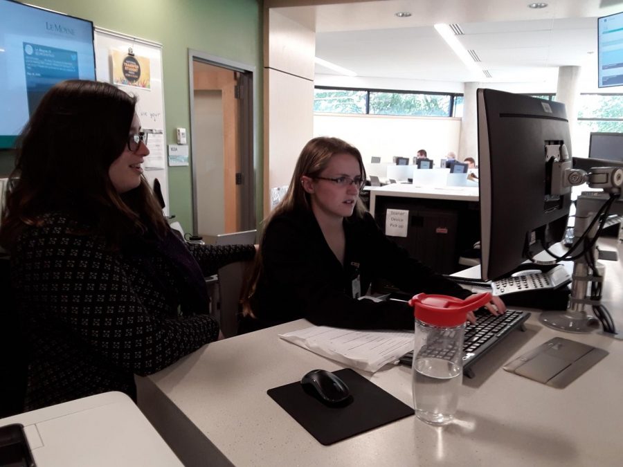 IT staff members Ranata De Gennaro (left) and Kassandra Neff work in the
Noreen Falcone library.