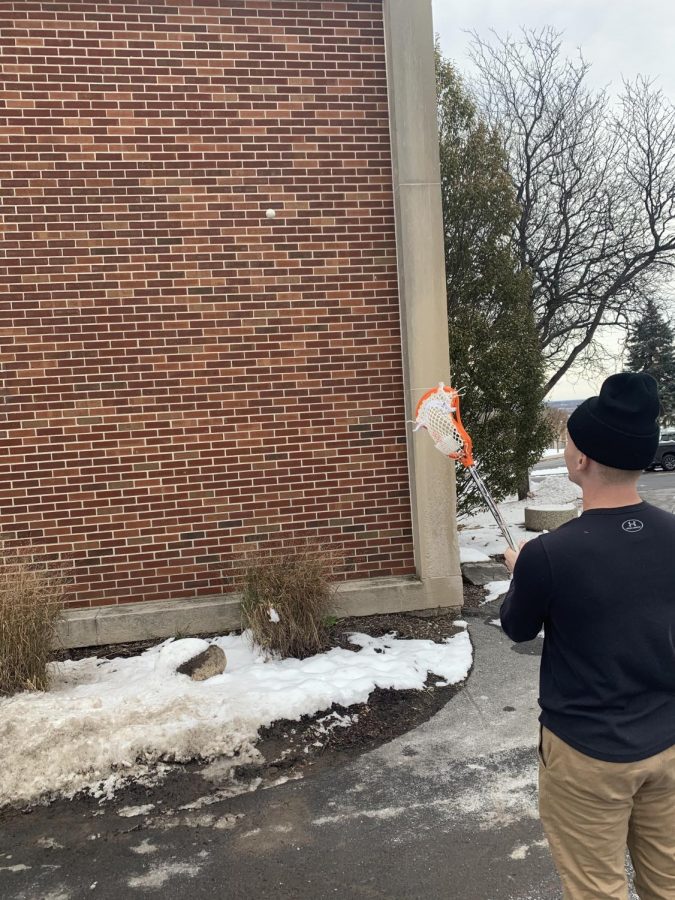 Sophomore Attackman Wyatt Martin plays a game of wall ball to prepare for the 2020 NCAA lacrosse season [Patrick Gilbert]